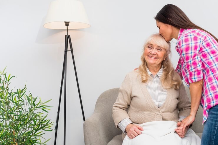 close-up-young-woman-kissing-her-mother-s-head_23-2148041426